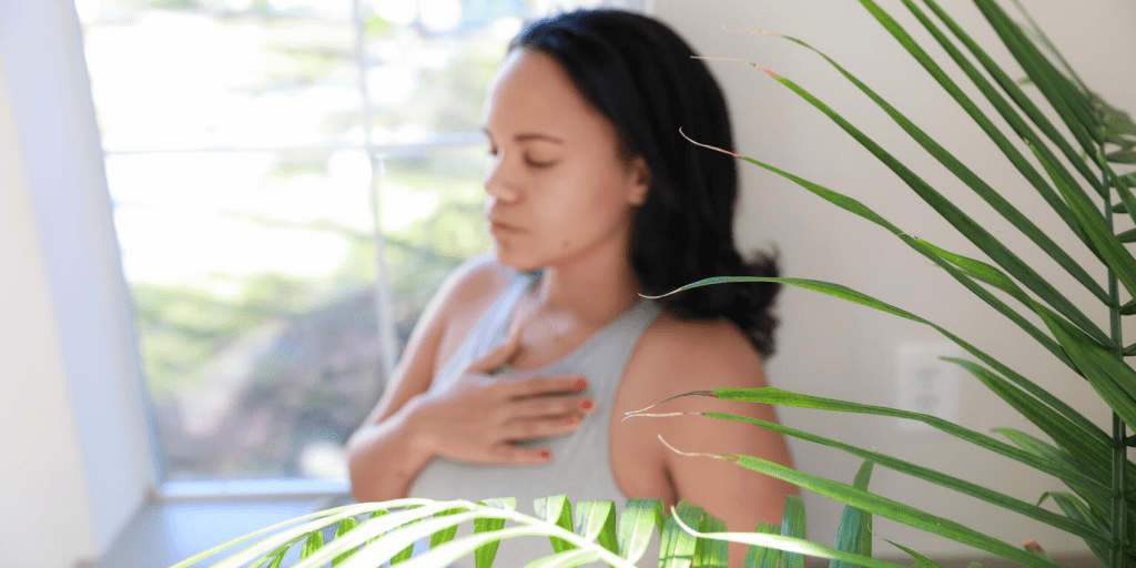 Young woman holding heart spiritual crisis