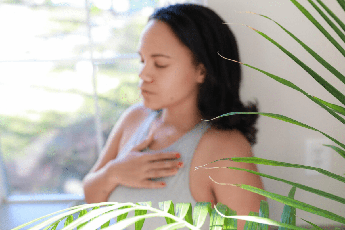 Young woman holding heart spiritual crisis
